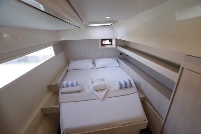 Bright double guest cabin on a cruising catamaran